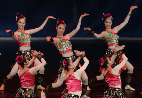 Artists from China's Guangxi Zhuang autonomous region perform to celebrate the Spring Festival and commemorate the 60th anniversary of the establishment of diplomatic relations between China and Algeria at the Opera of Algiers in Algeria on Tuesday. Xinhua