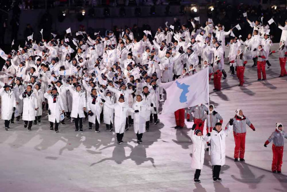 Joint Korean delegations enter the stadium during the opening ceremony. (Feng Yongbin/China Daily)