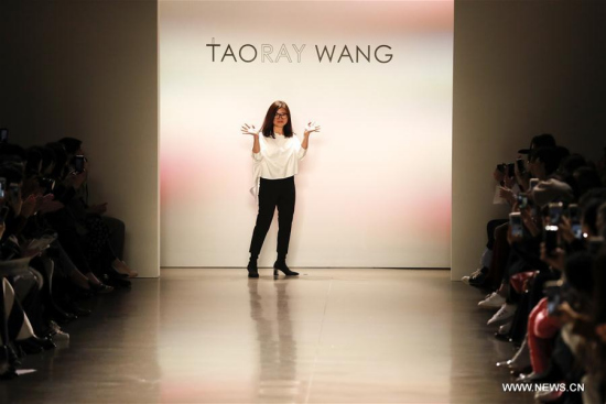 Chinese designer Wang Tao of TAORAY WANG greets the audience during the New York Fashion Week in New York, the United States, on Feb. 10, 2018. (Xinhua/Li Muzi)