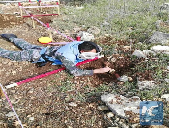 A Chinese peacekeeper in the UNIFIL discovered a mine buried underground along the UN Blue Line between Israel and Lebanon, on Feb. 5, 2018. (Xinhua)