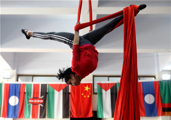 Students from Laos, Ethiopia, Sierra Leone and Tanzania study various performing skills at the Hebei Wuqiao Acrobatic Art School. They will be ready for public performances upon their graduation in August. (Photo by Wang Jing/China Daily)
