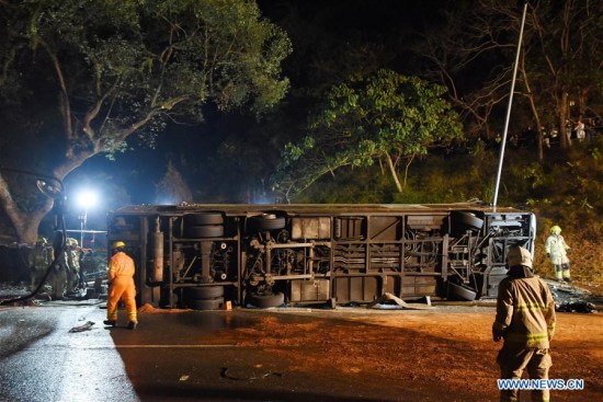 Rescuers work at the accident site where a double-decker bus overturned in New Territories in Hong Kong Special Administrative Region, south China, Feb. 10, 2018. (Xinhua/Wang Shen)