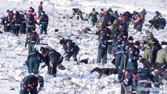 Screenshot from a video provided by Russian Emergencies Ministry on Feb. 12, 2018 shows Russian Emergencies Ministry officers working at the scene where the AN-148 passenger jet crashed on Feb. 11 in the Moscow region of Russia. (Xinhua/Sputnik)