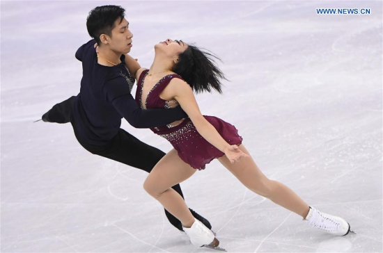Sui Wenjing (R) and Han Cong of China compete during the pair skating short program of figure skating at the 2018 PyeongChang Winter Olympic Games, in Gangneung Ice Arena, South Korea, on Feb. 14, 2018. Sui Wenjing and Han Cong won the first place in the pair skating short program with 82.39 points. (Xinhua/Wang Haofei)