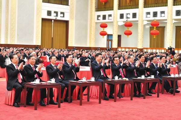 President Xi and top CPC and State leaders gather with guests at the reception. JU PENG AND LI TAO / XINHUA 