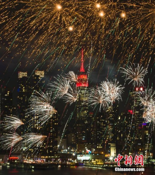 The top of the Empire State Building in Midtown Manhattan, New York, one of world's most beloved attractions, shine in red on Thursday to celebrate the Chinese New Year. (Photo: China News Service)