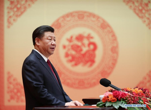 Chinese President Xi Jinping, also general secretary of the Communist Party of China (CPC) Central Committee and chairman of the Central Military Commission, delivers a speech to a festival reception at the Great Hall of the People in Beijing, capital of China, Feb. 14, 2018. Xi Jinping, on behalf of the CPC Central Committee and the State Council, extended Spring Festival greetings to all Chinese people Wednesday. (Xinhua/Ju Peng)