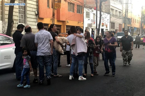 People gather on a street after a tremor was felt in Mexico City, capital of Mexico, on Feb. 16, 2018. A 7.1-magnitude earthquake hit Mexico at 7:39 a.m. Saturday (Beijing Time), according to the China Earthquake Networks Center (CENC). (Xinhua/Vanessa Feria)