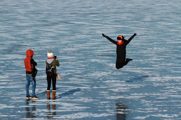 The Songhua River in Harbin turns into a playground for visitors in winter. Photo provided to China Daily