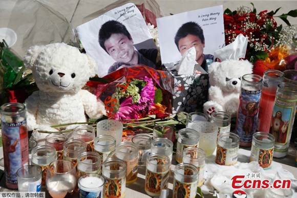 A memorial for Marjory Stoneman Douglas High School student Peter Wang in a park in Parkland, Florida, Feb. 16, 2018. Peter Wang, 15, was reportedly holding the door to his study hall open to help dozens of his fellow classmates escape on Feb. 14 before he was shot multiple times and killed by gunman Nikolas Cruz. (Photo/Agencies)