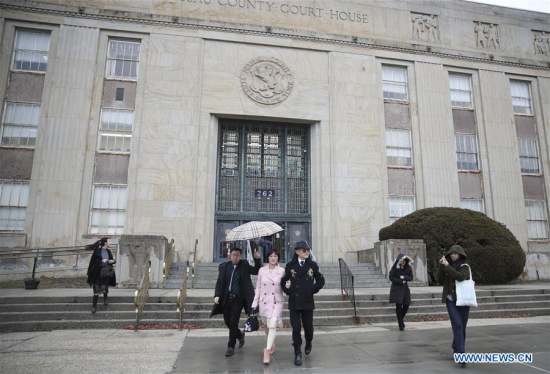 Zhou Libo (3rd R) walks out of the Nassau County Court after a court session in Nassau County, New York, the United States, on Feb. 22, 2018. (Xinhua/Wang Ying)