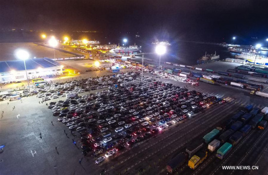 Vehicles wait for ferry service at Xinhaigang port in Haikou, capital of south China's Hainan Province, Feb. 22, 2018. (Xinhua/Yang Guanyu)