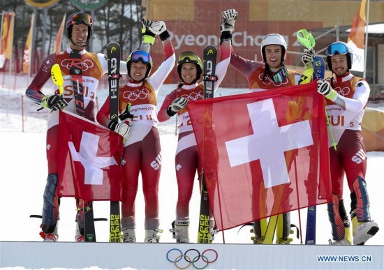 Team Switzerland celebrate after winning the team event final of alpine skiing at the 2018 PyeongChang Winter Olympic Games at Yongpyong Alpine Centre, PyeongChang, South Korea, Feb. 24, 2018. Team Switzerland beat Team Austria 3:1 and won the gold medal in the big final. (Xinhua/Bai Xuefei)