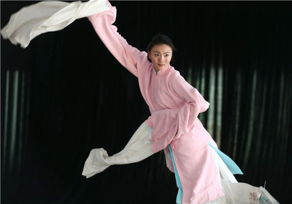 Peking Opera actress Li Li, one of Zhang Huoding's students, rehearses for her upcoming performance in Beijing in May. (Photo by Zou Hong/China Daily)
