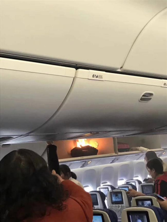 The baggage burst into flames with heavy smoke when passengers were getting onboard around yesterday noon on the China Southern Airlines flight from Guangzhou to Shanghai. (Photo/shine.cn)