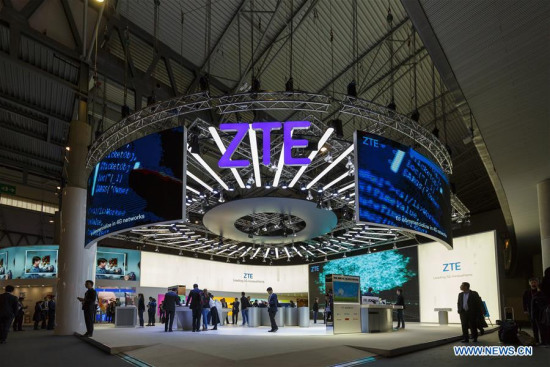 People visit ZTE's booth during the first day of the 2018 Mobile World Congress (MWC) in Barcelona, Spain, on Feb. 26, 2018. The four-day 2018 MWC opened its doors on Monday. (Xinhua/Joan Gosa)