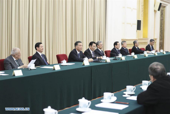 Wang Yang presides over the first meeting of the presidium of the first session of the 13th National Committee of the Chinese People's Political Consultative Conference (CPPCC) at the Great Hall of the People in Beijing, capital of China, March 2, 2018. (Xinhua/Ding Lin)