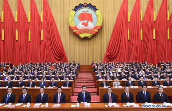 Xi Jinping (C, front), Li Keqiang (4th R, front), Zhang Dejiang (4th L, front), Yu Zhengsheng (3rd R, front), Zhang Gaoli (3rd L, front), Li Zhanshu (2nd R, front), Wang Huning (2nd L, front), Zhao Leji (1st R, front), and Han Zheng (1st L, front) attend the opening meeting of the first session of the 13th National Committee of the Chinese People's Political Consultative Conference at the Great Hall of the People in Beijing, capital of China, March 3, 2018. (Xinhua/Li Xueren)