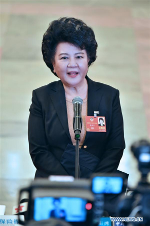 Qiu Yuanping, director of the Overseas Chinese Affairs Office of the State Council of China, receives an interview after the opening meeting of the first session of the 13th CPPCC National Committee at the Great Hall of the People in Beijing, capital of China, March 3, 2018. (Xinhua/Li Xin)