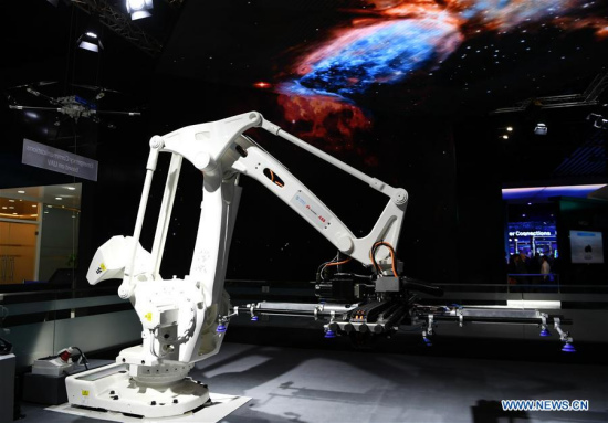 Photo taken on Feb. 28, 2018 shows a remote controlled robot based on 5G technologies jointly released by China's telecom giant Huawei, China Mobile and ABB Group during the 2018 Mobile World Congress (MWC) in Barcelona, Spain. 