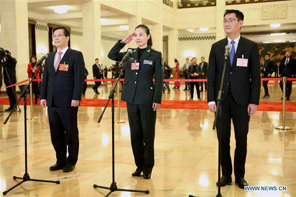 Ma Huateng (R), Wang Yaping (C) and Xu Liyi, deputies to the 13th National People's Congress (NPC), receive an interview before the opening meeting of the first session of the 13th NPC in Beijing, capital of China, March 5, 2018. (Xinhua/Jin Liwang)