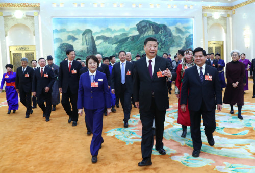 President Xi Jinping joins deputies from the Inner Mongolia autonomous region for a group discussion of the Government Work Report at the Great Hall of the People in Beijing on Monday. (Photo/Xinhua)
