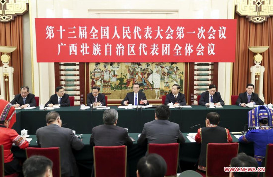 Chinese Premier Li Keqiang joins a panel discussion with the deputies from Guangxi Zhuang Autonomous Region at the first session of the 13th National People's Congress in Beijing, capital of China, March 6, 2018. (Xinhua/Ding Haitao)