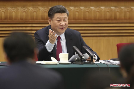 Chinese President Xi Jinping, also general secretary of the Communist Party of China (CPC) Central Committee and chairman of the Central Military Commission, joins a panel discussion with deputies from Shandong Province at the first session of the 13th National People's Congress in Beijing, capital of China, March 8, 2018. (Xinhua/Sheng Jiapeng)
