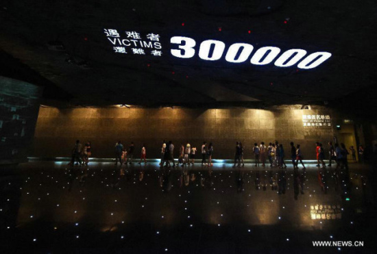 People visit the memorial hall of the victims of the Nanjing Massacre by Japanese invaders in Nanjing, capital of east China's Jiangsu Province. (File photo/Xinhua)