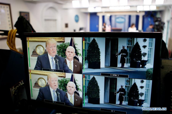 U.S. President Donald Trump is seen on a TV screen announcing tariffs on steel and aluminum, at the White House in Washington D.C., the United States, on March 8, 2018. (Xinhua/Ting Shen)