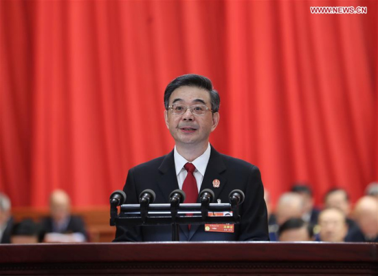 Chief Justice Zhou Qiang delivers a work report of the Supreme People's Court at the second plenary meeting of the first session of the 13th National People's Congress at the Great Hall of the People in Beijing, capital of China, March 9, 2018. (Xinhua/Wang Ye)