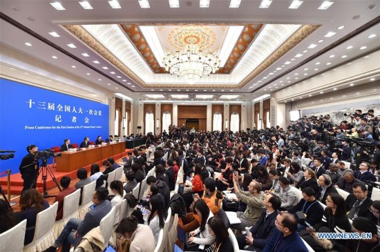 Shen Chunyao, secretary of the Bill Group of Secretariat of the first session of the 13th National People's Congress (NPC) and chairman of the Legislative Affairs Commission of the NPC Standing Committee, and Zheng Shuna, deputy secretary of the Bill Group of Secretariat of the first session of the 13th NPC and vice chairperson of the Legislative Affairs Commission of the NPC Standing Committee, take questions at a press conference on an amendment to the country's Constitution in Beijing, capital of China, March 11, 2018. (Xinhua/Li Xin)