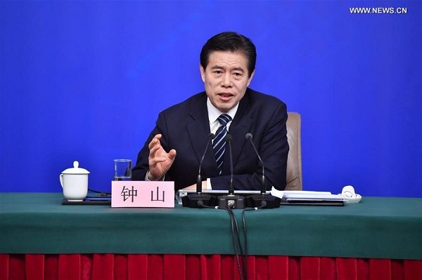Chinese Minister of Commerce Zhong Shan answers questions at a press conference on opening up on all fronts and promoting high quality development of commercial business on the sidelines of the first session of the 13th National People's Congress in Beijing, capital of China, March 11, 2018. (Xinhua/Li Xin)