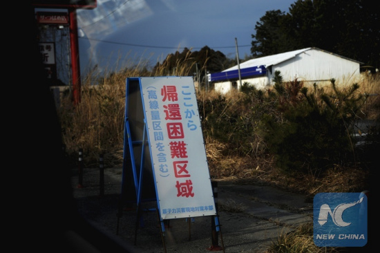 File Photo taken on Feb. 22, 2017 shows a warning sign at Okuma near the Fukushima Daiichi nuclear power plant, Fukushima Prefecture, Japan. (Xinhua/Hua Yi)