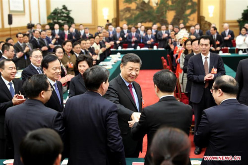 President Xi Jinping, also general secretary of the Communist Party of China (CPC) Central Committee and chairman of the Central Military Commission, joins a panel discussion with the deputies from southwestern municipality of Chongqing at the first session of the 13th National People's Congress in Beijing, March 10, 2018. (Photo/Xinhua)