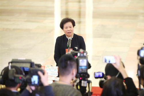 Liu Yaming, head of China Meteorological Administration, receives an interview after the fourth plenary meeting of the first session of the 13th National People's Congress at the Great Hall of the People in Beijing, March 13, 2018. (Photo/Xinhua)