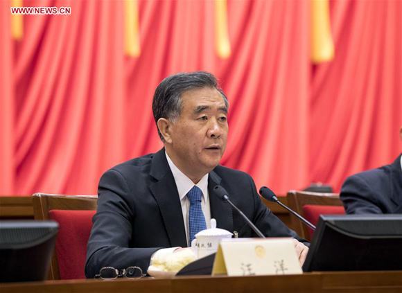 Wang Yang, a member of the Standing Committee of the Political Bureau of the Communist Party of China (CPC) Central Committee, presides over the third meeting of the presidium of the first session of the 13th National Committee of the Chinese People's Political Consultative Conference (CPPCC) in Beijing, capital of China, March 14, 2018. (Xinhua/Li Xueren)
