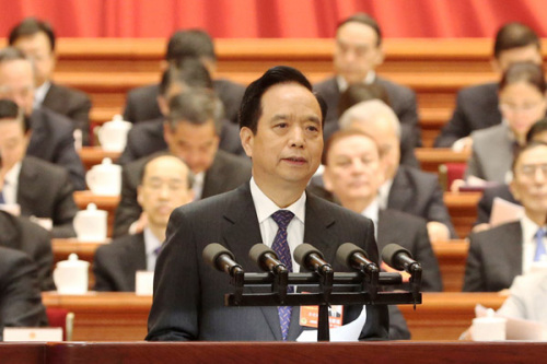 Li Jianguo speaks at the fourth plenary meeting of the first session of the 13th National People's Congress at the Great Hall of the People in Beijing on Tuesday. (Photo/China Daily)