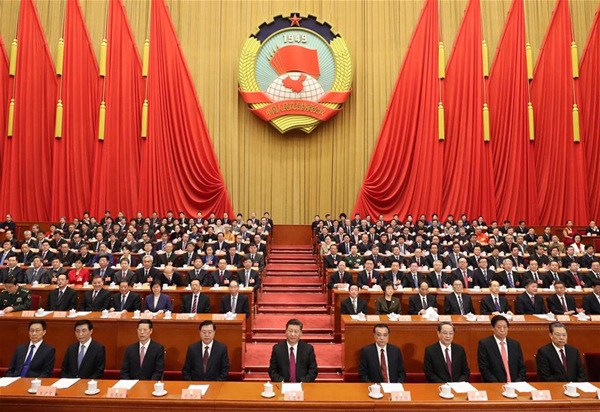 Xi Jinping (C, front), Li Keqiang (4th R, front), Zhang Dejiang (4th L, front), Yu Zhengsheng (3rd R, front), Zhang Gaoli (3rd L, front), Li Zhanshu (2nd R, front), Wang Huning (2nd L, front), Zhao Leji (1st R, front) and Han Zheng (1st L, front) attend the closing meeting of the First Session of the 13th National Committee of the Chinese People's Political Consultative Conference (CPPCC) at the Great Hall of the People in Beijing, capital of China, March 15, 2018. (Xinhua/Ding Lin)