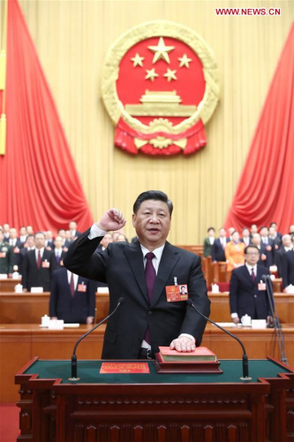 Xi Jinping takes a public oath of allegiance to the Constitution in the Great Hall of the People in Beijing, capital of China, March 17, 2018. Xi was elected Chinese president and chairman of the Central Military Commission of the People's Republic of China earlier Saturday at the ongoing first session of the 13th National People's Congress, the national legislature. (Xinhua/Ju Peng)