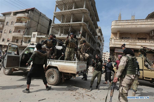 The Free Syrian Army fighters are seen in Afrin city, Syria, on March 18, 2018. Turkish troops and allied Syrian rebels have taken the Afrin city center under control following two-month fighting, Turkish President Recep Tayyip Erdogan said on Sunday. (Xinhua)