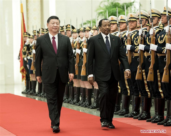 Chinese President Xi Jinping (L) holds a welcome ceremony for visiting Cameroonian President Paul Biya before their talks at the Great Hall of the People in Beijing, capital of China, March 22, 2018. (Xinhua/Li Tao)