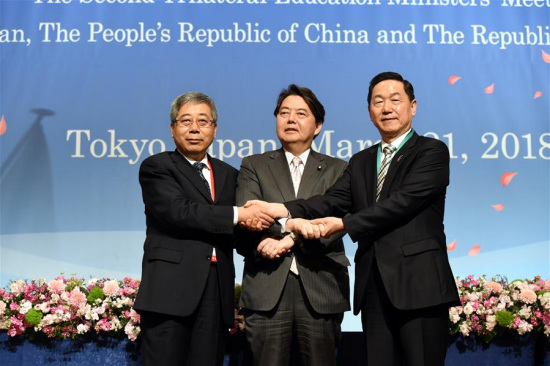 Chinese Minister of Education Chen Baosheng (L) poses for photos with his Japanese counterpart Yoshimasa Hayashi (C), and South Korean Education Minister Kim Sang-gon (R) in Tokyo, Japan, March 21, 2018. Education ministers of China, Japan, and the Republic of Korea (ROK) exchanged views on further enhancing cooperation in education areas at the second China-Japan-ROK Education Ministers' Meeting held here on Wednesday.(Xinhua/Ma Ping)