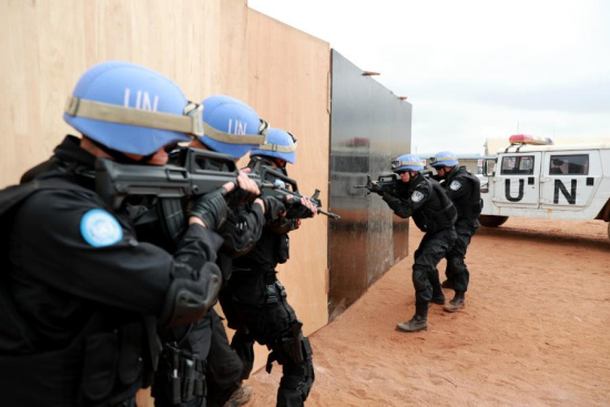Members of the fifth Chinese peacekeeping police team in Liberia take part in an integrated tactical drill in Monrovia, the capital of Liberia, on Friday in preparation for a variety of emergency situations. (Photo/Xinhua)