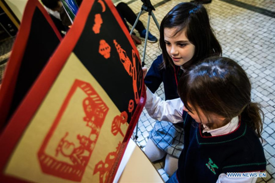 Students from Italian International School visit at an exhibition in Bologna, Italy, on March 28, 2018. An exhibition of picture books created by Chinese children kicked off on Wednesday, during the 55th Bologna Children's Book Fair. (Xinhua/Jin Yu)