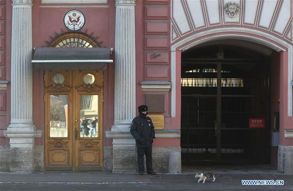 A police officer stands guard at the U.S. consulate general in St. Petersburg, Russia, March 30, 2018. Russia will expel 60 U.S. diplomats and shut the U.S. consulate general in St. Petersburg in tit-for-tat retaliation for Washington's moves against Moscow over an ex-spy incident, the Russian Foreign Ministry said Thursday. (Xinhua/Lu Jinbo)