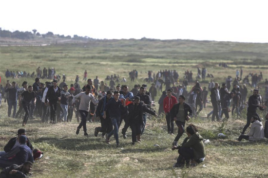 A wounded Palestinian is evacuated during a protest along the border fence between Gaza Strip and Israel in Gaza City, March 30, 2018. (Xinhua/Wissam Nassar)