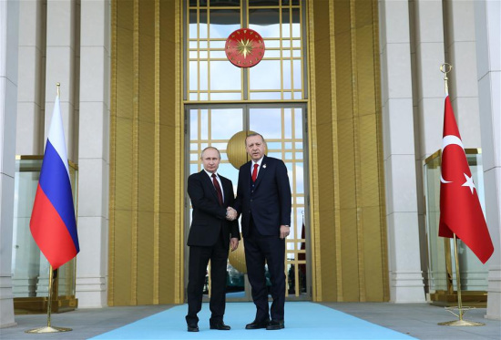 Turkish President Recep Tayyip Erdogan (R) welcomes Russian President Vladimir Putin at the Presidential Palace in Ankara, Turkey, on April 3, 2018. (Xinhua/Turkish Presidential Palace)