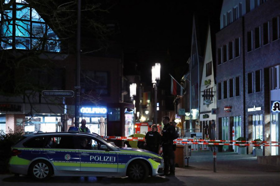 Police officers stand guard at the site of the vehicle plowing in Muenster, Germany, on April 7, 2018. (Xinhua/Luo Huanhuan)