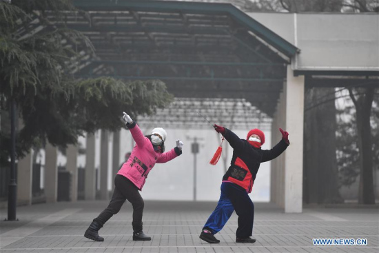 Women do morning exercises in Beijing's Taoranting Park in 2016. (Photo/Xinhua)